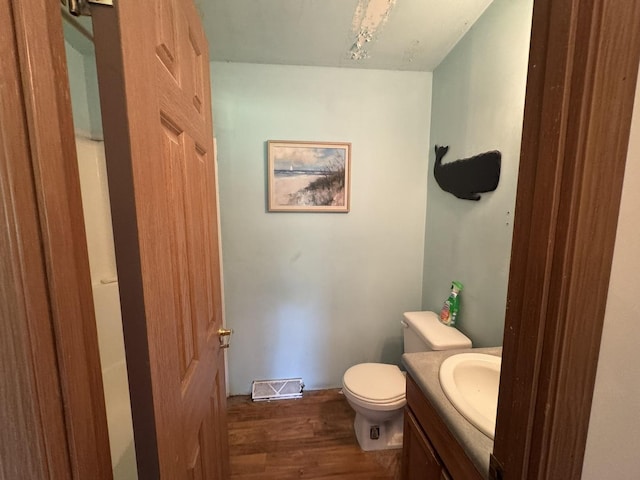 810 Harding Ave, Gillespie, IL 62033 - half bathroom featuring vanity and wood finished floors