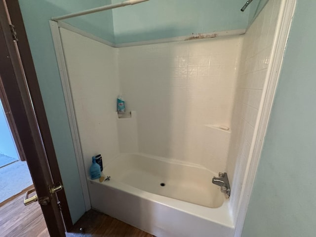 810 Harding Ave, Gillespie, IL 62033 - full bathroom with washtub / shower combination and wood finished floors