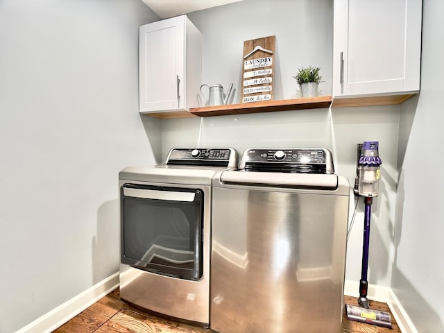 120 Walter Ct, Bloomingdale, IL 60108 - laundry room featuring cabinet space, washer and clothes dryer, and wood finished floors