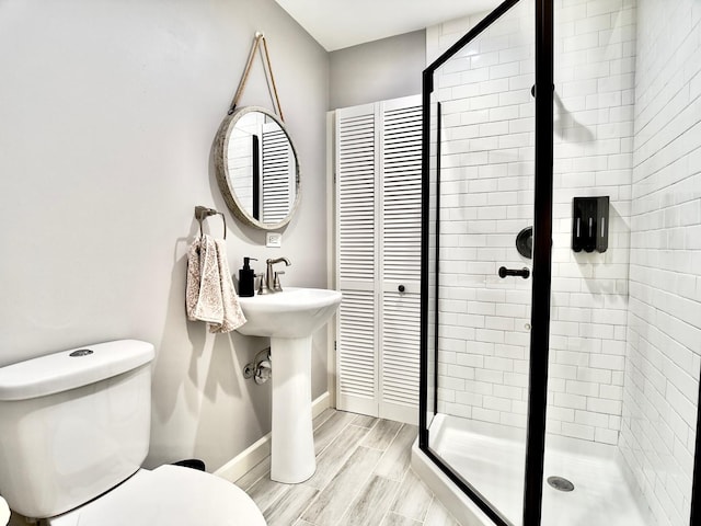 120 Walter Ct, Bloomingdale, IL 60108 - bathroom with a stall shower, wood finished floors, and a closet