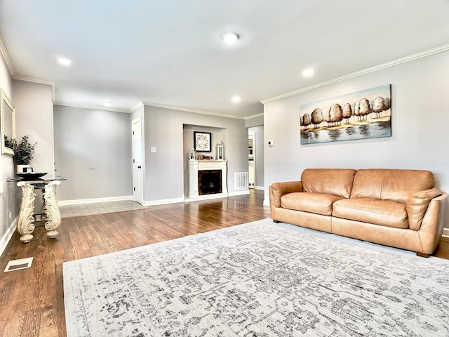120 Walter Ct, Bloomingdale, IL 60108 - living room featuring wood finished floors, ornamental molding, recessed lighting, and a fireplace