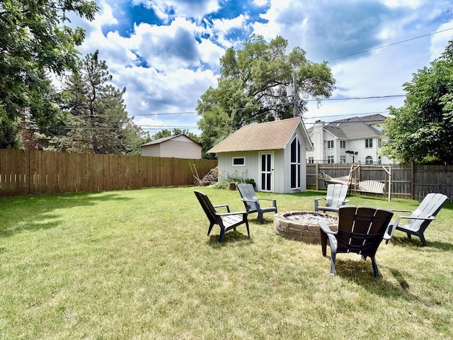 120 Walter Ct, Bloomingdale, IL 60108 - fenced backyard with an outdoor fire pit and an outbuilding