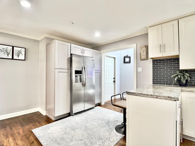 120 Walter Ct, Bloomingdale, IL 60108 - kitchen featuring stainless steel refrigerator with ice dispenser, ornamental molding, dark wood finished floors, decorative backsplash, and light stone counters