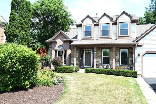 46 Copperwood Dr, Buffalo Grove, IL 60089 - view of front of property featuring a front yard, stone siding, and roof with shingles
