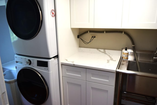 46 Copperwood Dr, Buffalo Grove, IL 60089 - laundry area featuring stacked washer and clothes dryer and cabinet space