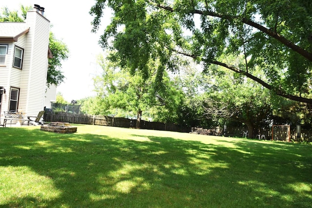 46 Copperwood Dr, Buffalo Grove, IL 60089 - view of yard featuring an outdoor fire pit