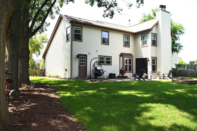 46 Copperwood Dr, Buffalo Grove, IL 60089 - rear view of property featuring a fire pit, a patio, and a chimney