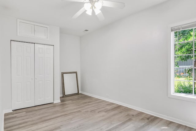 41607 N Lotus Ave, Antioch, IL 60002 - unfurnished bedroom with light wood finished floors, a closet, and ceiling fan