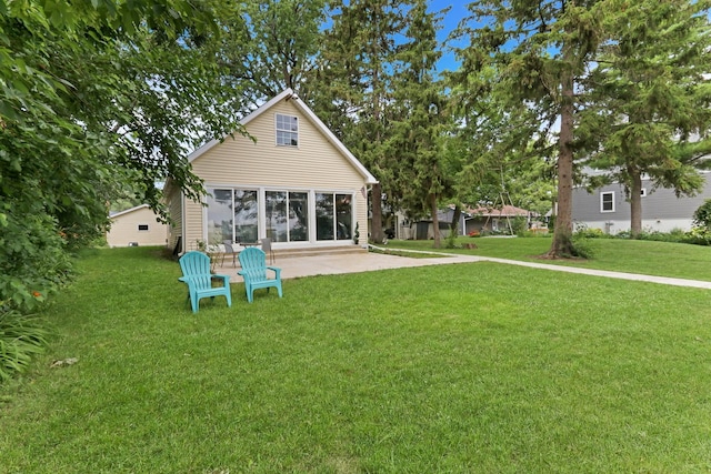 41607 N Lotus Ave, Antioch, IL 60002 - rear view of house featuring a yard and a patio