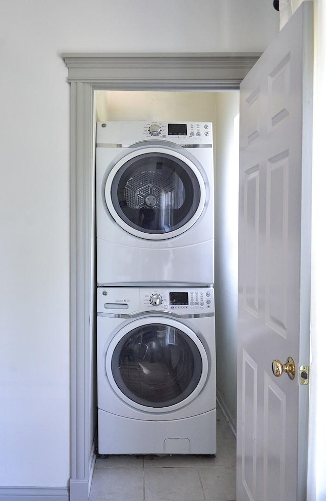 1654 W Berwyn Ave Unit 2W, Chicago, IL 60640 - washroom with stacked washing machine and dryer and light tile patterned floors