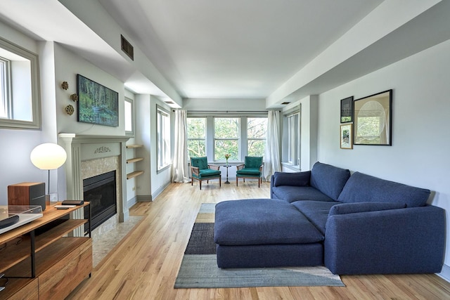 1654 W Berwyn Ave Unit 2W, Chicago, IL 60640 - living area featuring light wood-type flooring and a fireplace