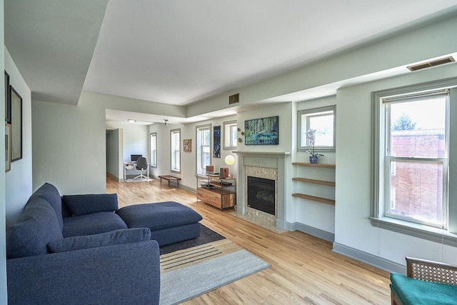 1654 W Berwyn Ave Unit 2W, Chicago, IL 60640 - living room featuring a high end fireplace and light wood-style floors