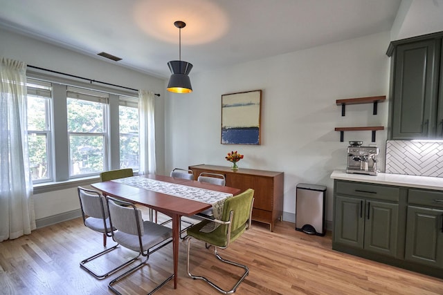 1654 W Berwyn Ave Unit 2W, Chicago, IL 60640 - dining area featuring light wood-style floors and baseboards