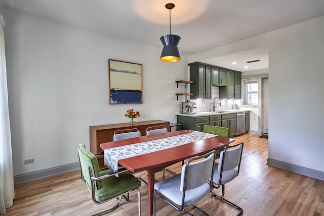 1654 W Berwyn Ave Unit 2W, Chicago, IL 60640 - dining room featuring light wood-style floors and baseboards