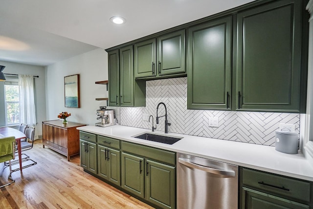 1654 W Berwyn Ave Unit 2W, Chicago, IL 60640 - kitchen with stainless steel dishwasher, green cabinetry, light countertops, backsplash, and light wood finished floors