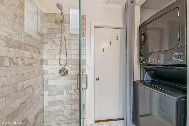 1407 N Wells St Unit 3E, Chicago, IL 60610 - full bathroom with stacked washer and clothes dryer, a stall shower, and tile patterned floors