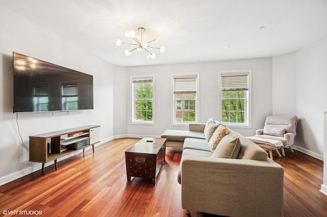 1657 Church St, Evanston, IL 60201 - living area featuring plenty of natural light, wood finished floors, and a chandelier