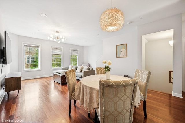1657 Church St, Evanston, IL 60201 - dining room featuring a chandelier and wood finished floors