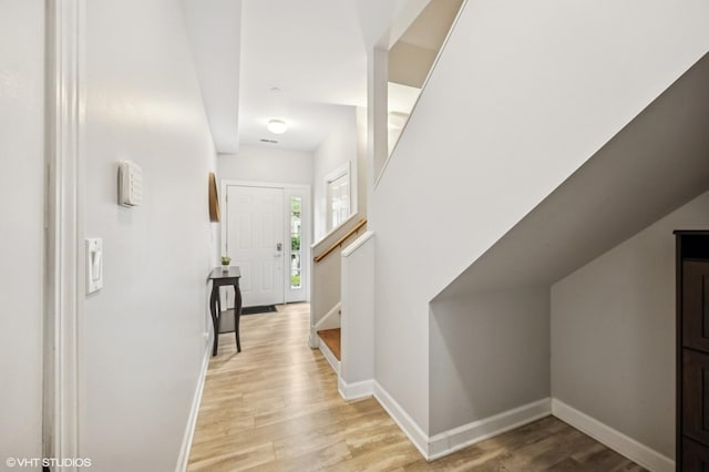 1657 Church St, Evanston, IL 60201 - corridor featuring light wood-style floors and stairway