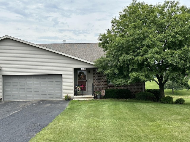 15459 Henry Rd Unit A, Morrison, IL 61270 - single story home with driveway, a front lawn, roof with shingles, brick siding, and an attached garage