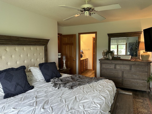 15459 Henry Rd Unit A, Morrison, IL 61270 - bedroom featuring dark wood finished floors, ceiling fan, and connected bathroom