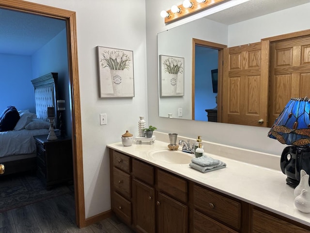 15459 Henry Rd Unit A, Morrison, IL 61270 - bathroom featuring connected bathroom, vanity, and wood finished floors