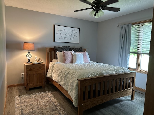 15459 Henry Rd Unit A, Morrison, IL 61270 - bedroom featuring multiple windows, wood finished floors, and ceiling fan
