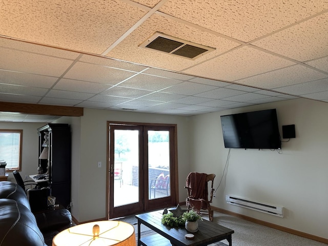 15459 Henry Rd Unit A, Morrison, IL 61270 - living room with a baseboard heating unit, a drop ceiling, and carpet floors