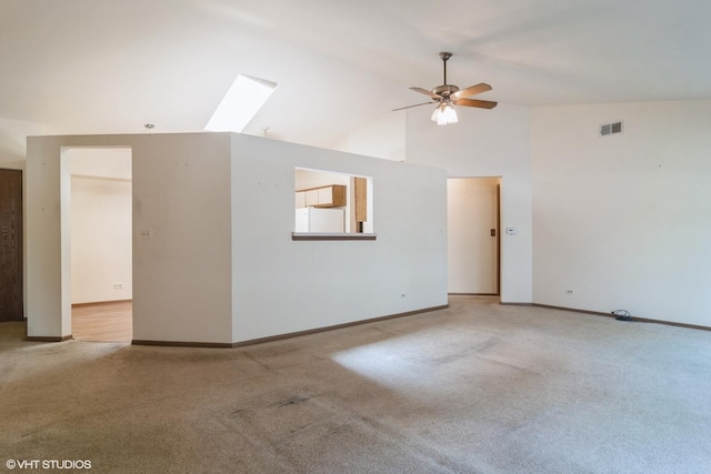 4130 N Pheasant Trail Ct Unit 2, Arlington Heights, IL 60004 - unfurnished living room featuring a skylight, a ceiling fan, carpet, and high vaulted ceiling