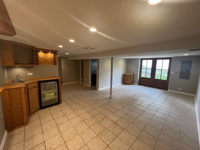 7830 Westview Ln, Woodridge, IL 60517 - unfurnished living room with beverage cooler, electric panel, bar with sink, light tile patterned flooring, and french doors
