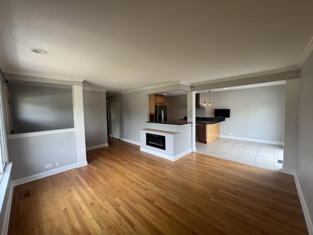 7830 Westview Ln, Woodridge, IL 60517 - unfurnished living room with light wood-type flooring and ornamental molding