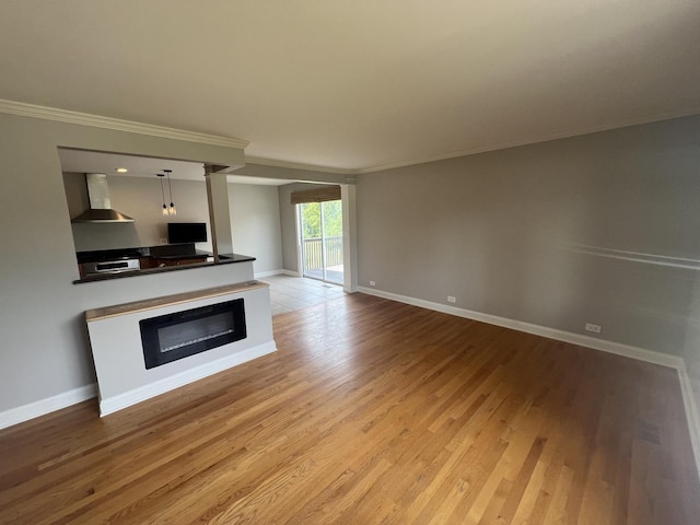 7830 Westview Ln, Woodridge, IL 60517 - unfurnished living room featuring light wood finished floors and ornamental molding