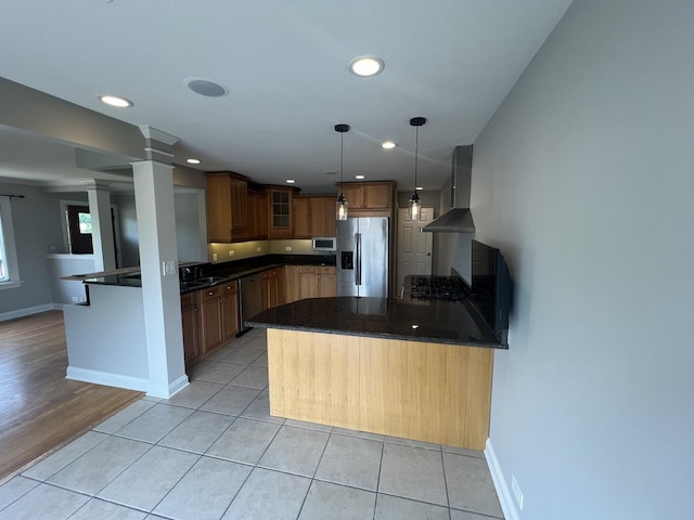 7830 Westview Ln, Woodridge, IL 60517 - kitchen featuring appliances with stainless steel finishes, wall chimney range hood, a peninsula, glass insert cabinets, and decorative columns