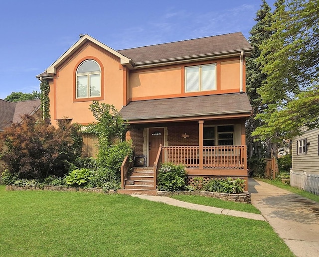 974 Webster Ln, Des Plaines, IL 60016 - view of front of property featuring covered porch, a front lawn, and stucco siding