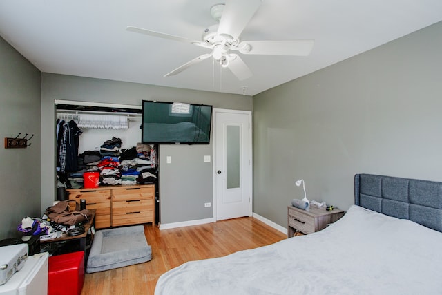 974 Webster Ln, Des Plaines, IL 60016 - bedroom featuring wood finished floors, a ceiling fan, and a closet