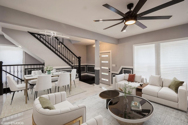 11616 S Lowe Ave, Chicago, IL 60628 - living area with a ceiling fan, wainscoting, and stairway