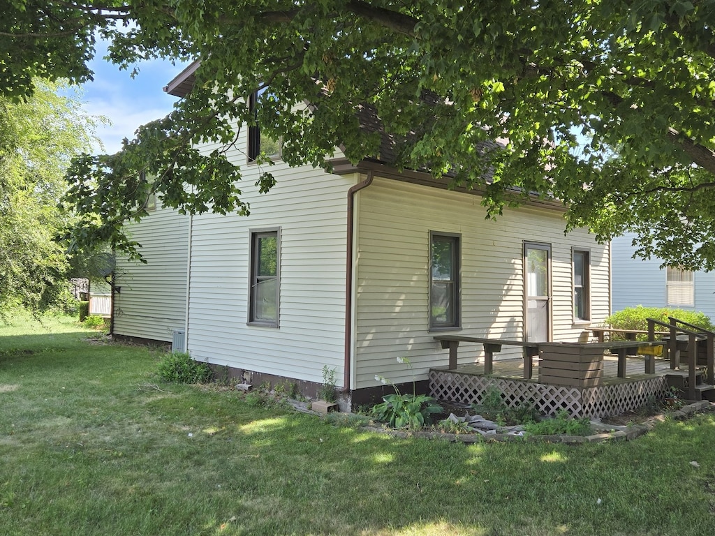 308 Bodman, Milmine, IL 61855 - rear view of house with a deck and a lawn