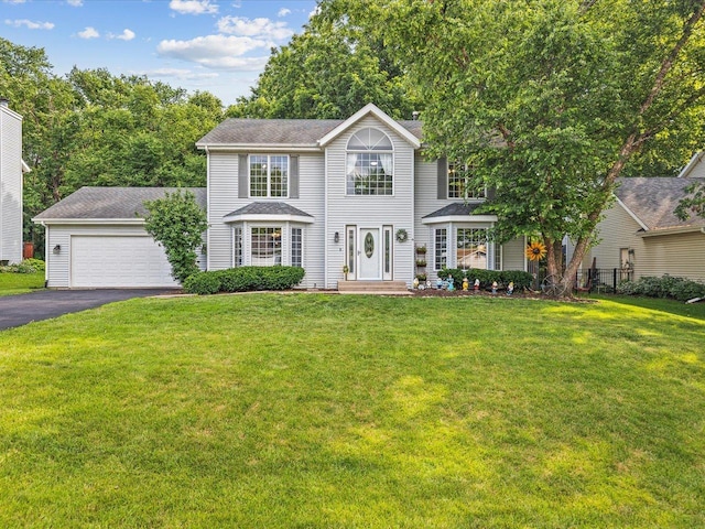 316 Harwich Pl, Rockton, IL 61072 - colonial inspired home with asphalt driveway and a front lawn