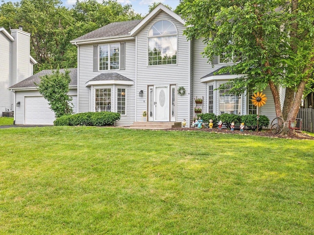 316 Harwich Pl, Rockton, IL 61072 - view of front of property with an attached garage, a front lawn, driveway, and roof with shingles