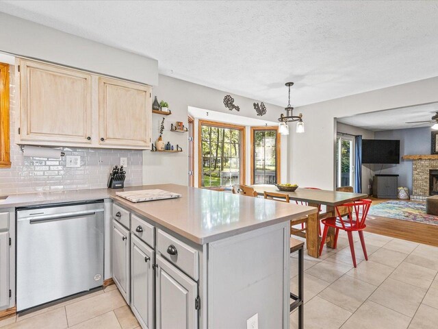 316 Harwich Pl, Rockton, IL 61072 - kitchen with dishwasher, a peninsula, backsplash, open floor plan, and light countertops