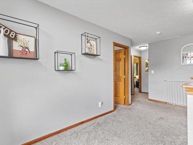 316 Harwich Pl, Rockton, IL 61072 - carpeted empty room with baseboards and a textured ceiling
