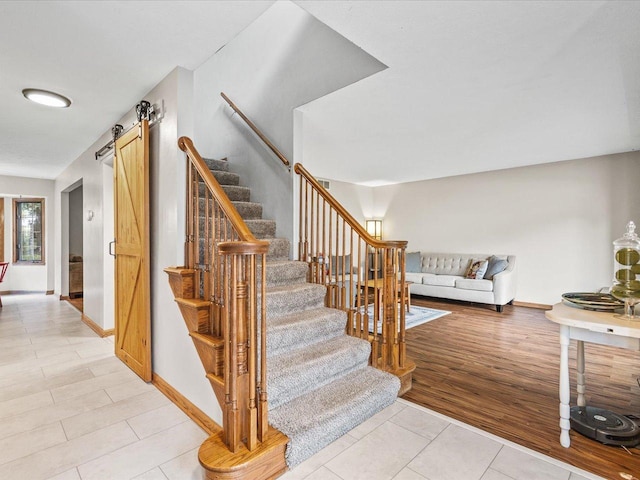 316 Harwich Pl, Rockton, IL 61072 - staircase featuring a barn door and tile patterned floors