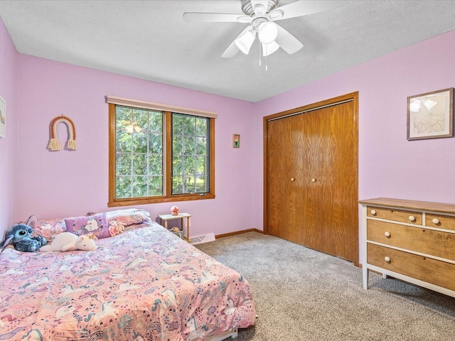 316 Harwich Pl, Rockton, IL 61072 - carpeted bedroom with a textured ceiling, a closet, and ceiling fan