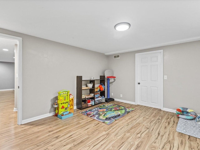 316 Harwich Pl, Rockton, IL 61072 - playroom with wood finished floors and baseboards