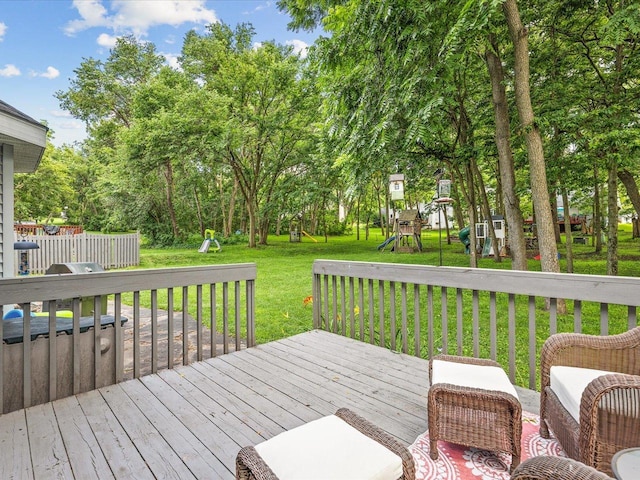 316 Harwich Pl, Rockton, IL 61072 - wooden deck with a playground, a lawn, and view of scattered trees