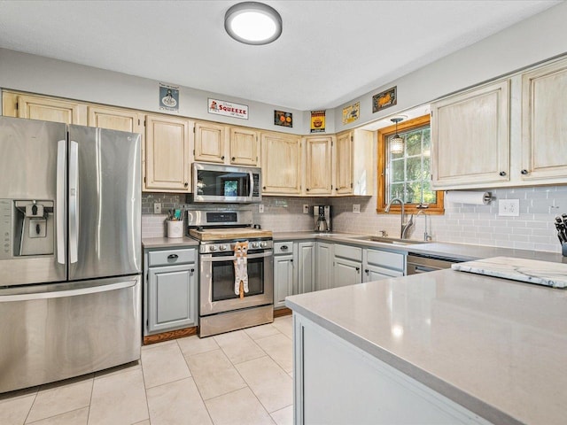 316 Harwich Pl, Rockton, IL 61072 - kitchen with appliances with stainless steel finishes, tasteful backsplash, light countertops, and light tile patterned floors