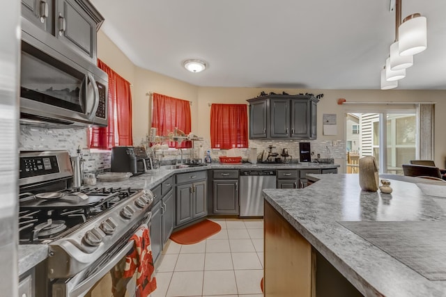 22401 Helen Dr, Sauk Village, IL 60411 - kitchen with appliances with stainless steel finishes, gray cabinets, backsplash, light tile patterned flooring, and pendant lighting