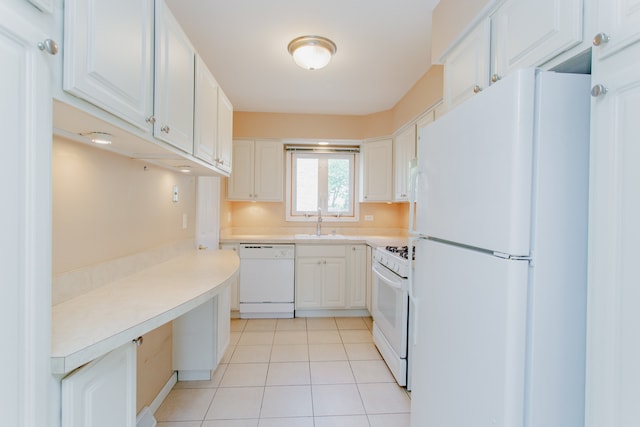 590 Green Bay Rd, Glencoe, IL 60022 - kitchen with white appliances, light countertops, light tile patterned flooring, and white cabinetry