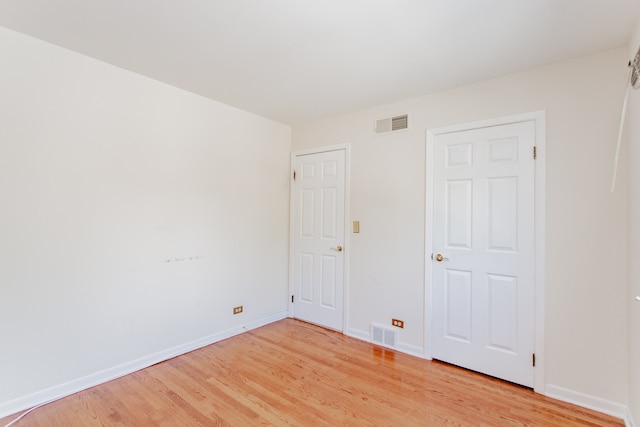 590 Green Bay Rd, Glencoe, IL 60022 - unfurnished bedroom featuring light wood-style flooring