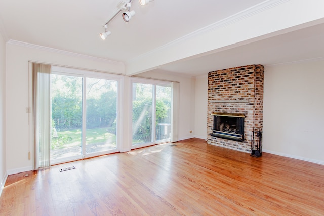 590 Green Bay Rd, Glencoe, IL 60022 - unfurnished living room with wood finished floors, a brick fireplace, and crown molding